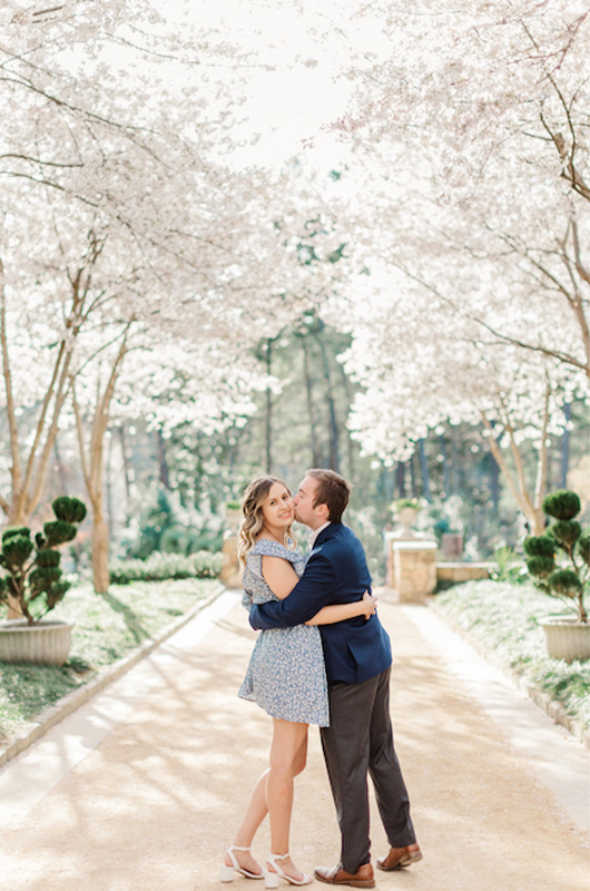 Kristin And Hunters Romantic Cherry Blossom Engagement Groom Kisses Bride On Cheek Copy