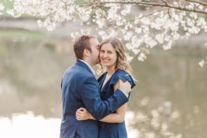 Kristin And Hunters Romantic Cherry Blossom Engagement Groom Whispers To Bride Copy