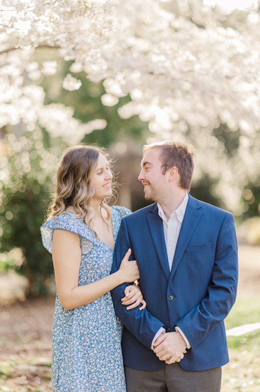 Kristin And Hunters Romantic Cherry Blossom Engagement Smiling At Each Other Copy