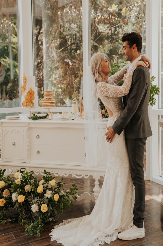 A Playful Romance Styled Shoot in front of cake