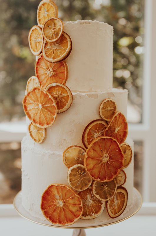 A Playful Romance Styled Shoot orange cake