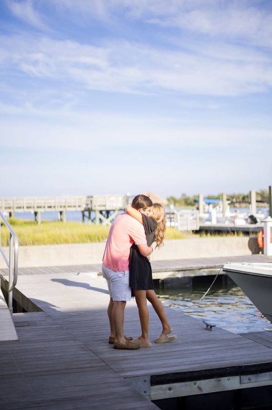 Rachel Lewis and Mason Coopers sweet engagement at the Beaufort Hotel North Carolina Hug and Kiss