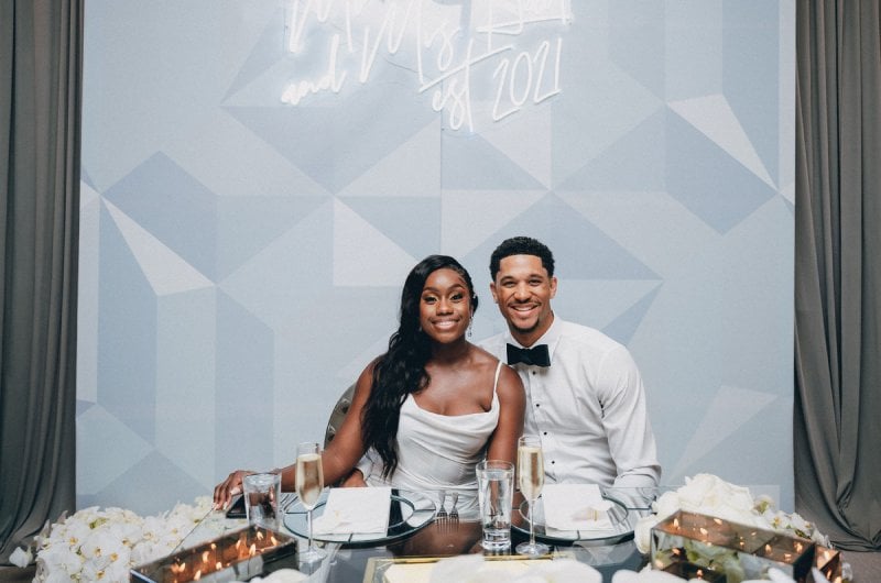 Shannon Phillips and Josh Hart Neon Sign and Dinner Table