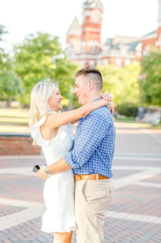 kayla and stuarts engagement at their alma mater embrace