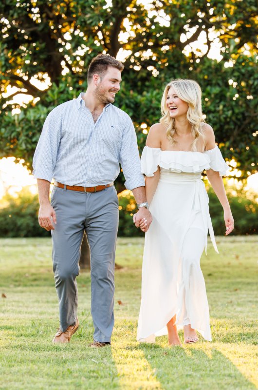 kayla and stuarts engagement at their alma mater laughing