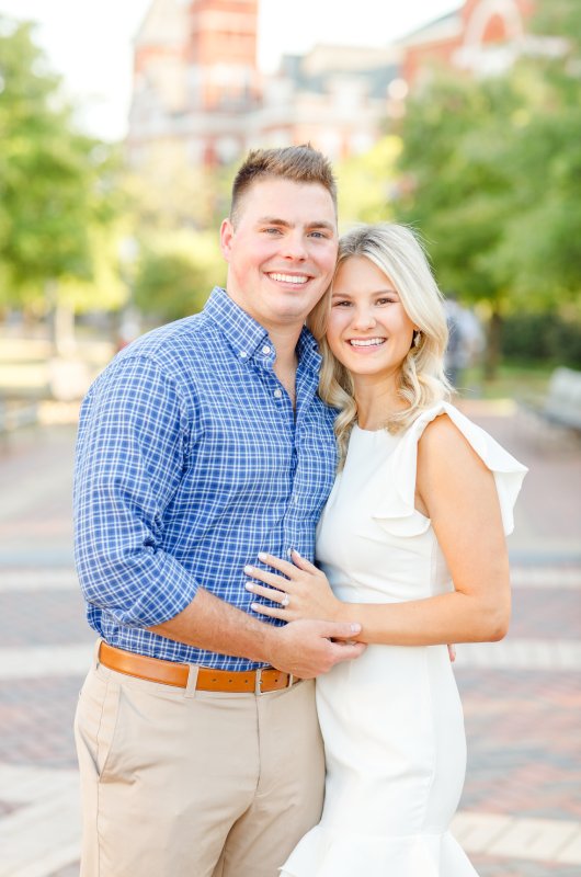 kayla and stuarts engagement at their alma mater portrait