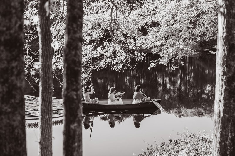 Elizabeth and Michael Marry at a Beautiful Fall Forest Wedding Canoe and Bride