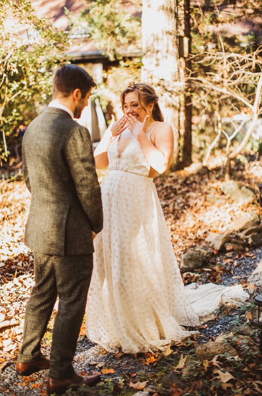 Elizabeth and Michael Marry at a Beautiful Fall Forest Wedding First Look Smile