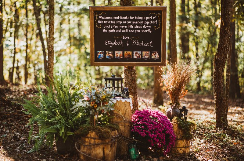 Elizabeth and Michael Marry at a Beautiful Fall Forest Wedding Sign