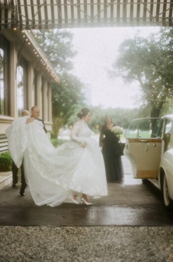 Elizabeth Smith and Christopher Newtons Beautiful Wedding in Houston Texas Carrying Dress