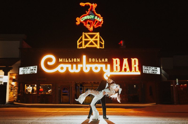 Jenny Tolman and Dave Brainard were married under the majestic Teton Mountain Range at Split Creek Ranch in Jackson Wyoming Cowboy Bar