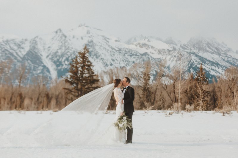 Jenny Tolman and Dave Brainard were married under the majestic Teton Mountain Range at Split Creek Ranch in Jackson Wyoming Kiss
