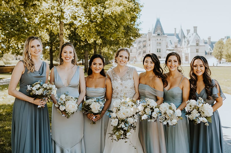 Emily and Matt Marry in a Classic Church Ceremony with a Vintage Reception Bride and Bridesmaids Outside Biltmore Estate