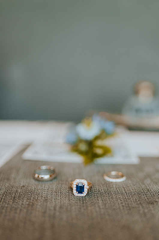 Emily and Matt Marry in a Classic Church Ceremony with a Vintage Reception Wedding Rings