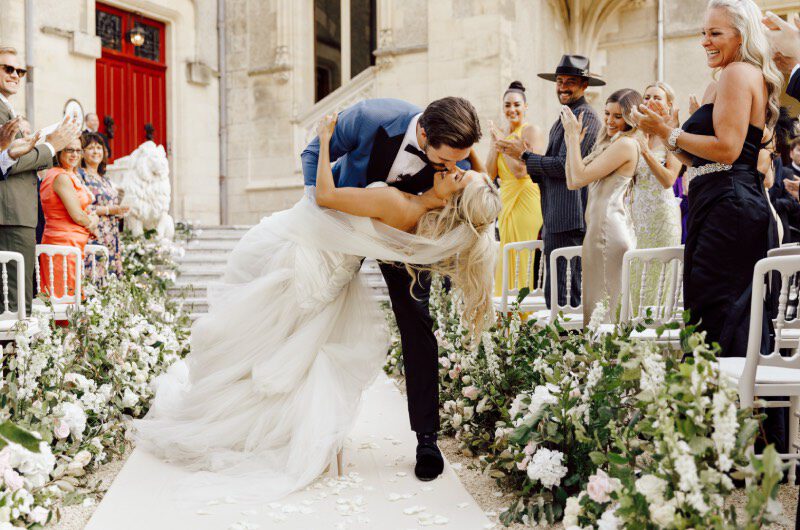 Erin Alvey and Filip Forsberg Wedding in La Guerche sur lAubois France Aisle Kiss