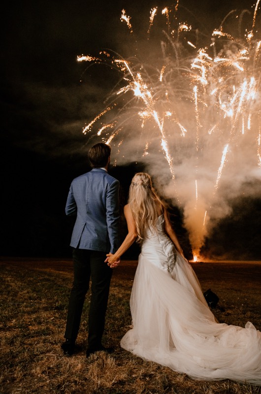 Erin Alvey and Filip Forsberg Wedding in La Guerche sur lAubois France Fireworks Holding Hands