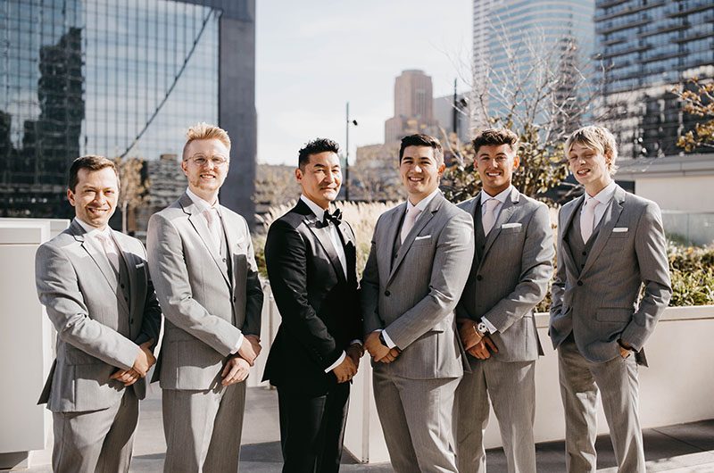 A Beautiful Ballroom Reception at the Four Seasons Hotel Minneapolis Groom with Groomsmen on the Terrace