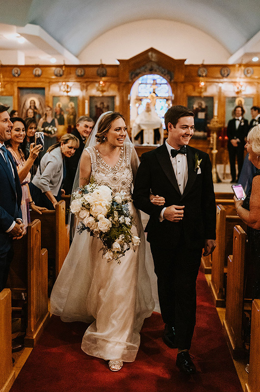 Emily and Matt Marry in a Classic Church Ceremony with a Vintage Reception Bride and Groom Walking Down Aisle