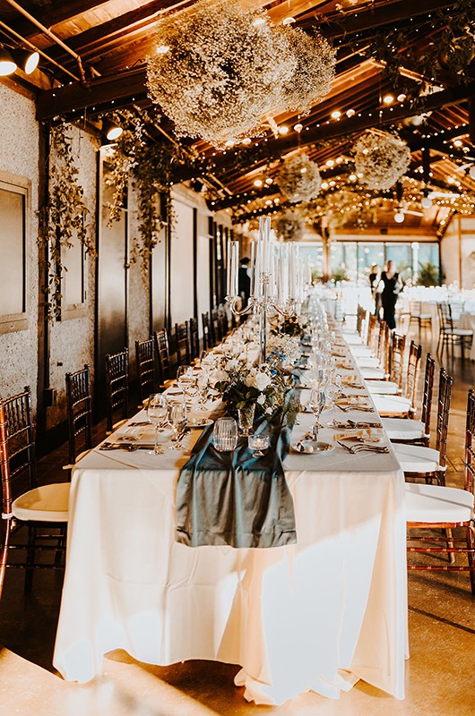 Emily and Matt Marry in a Classic Church Ceremony with a Vintage Reception Dinner Tables