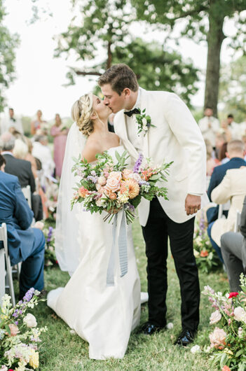 alisa adkison and miles svoboda garden style wedding in tennessee aisle kiss