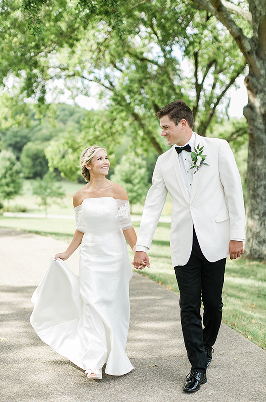 alisa adkison and miles svoboda garden style wedding in tennessee walking