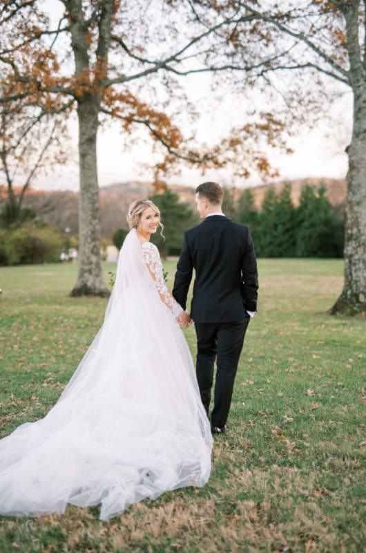 Alex Peele and Michael Oates Wedding in Brentwood Tennessee Bride Looking Back