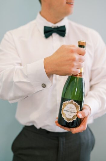 Alex Peele and Michael Oates Wedding in Brentwood Tennessee Flower Arrangement Alex Peele and Michael Oates Wedding in Brentwood Tennessee Champagne Bottle