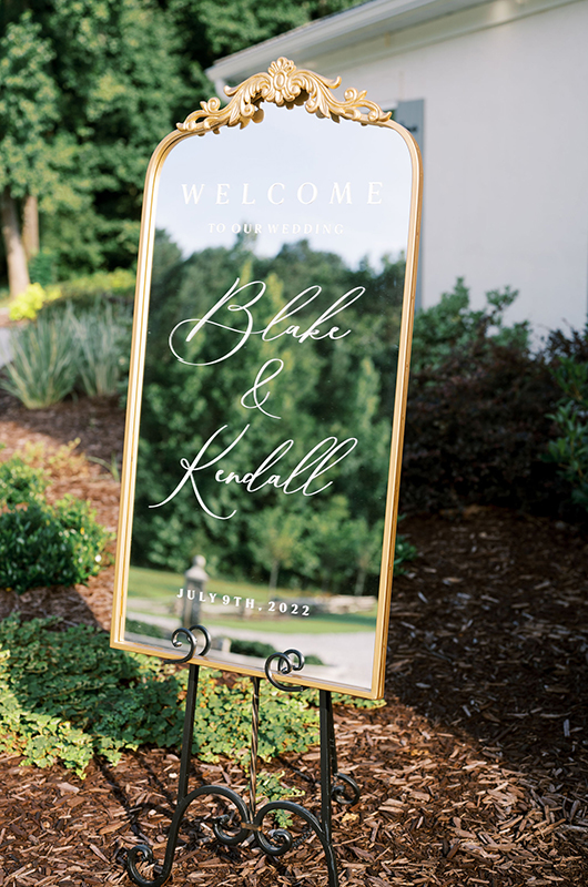 Kendall and Blake Marry in a Whimsical Ceremony at White Fox Cottage Welcome Sign