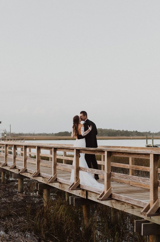 Madelyn and Alex Marry in South Carolina Embrace Madelyn and Alex Marry in South Carolina Pier