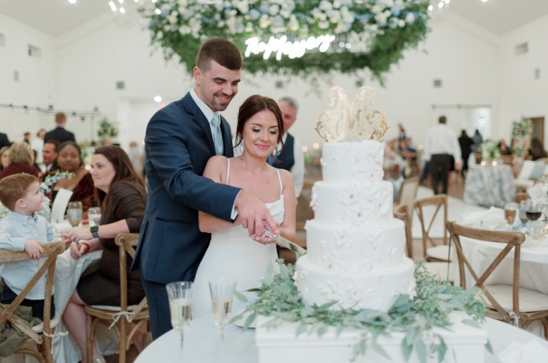 Hannah Justin Messer Cutting Cake