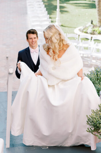 Plotz Signorin Wedding groom helping with dress Plotz Signorin Wedding groom helping with dress
