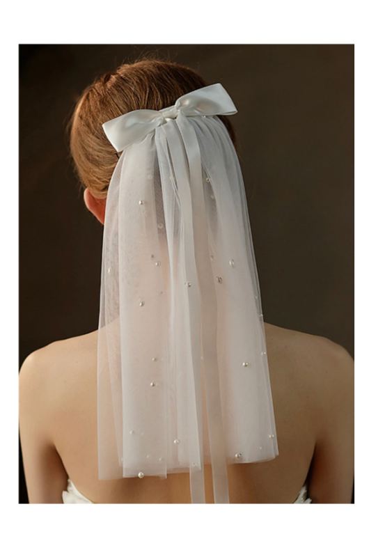 Bridal Trends For The Fall bow veil jj house