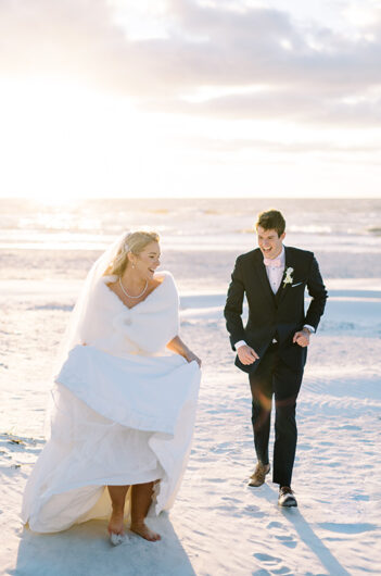 Plotz Signorin Wedding running on beach Plotz Signorin Wedding running on beach