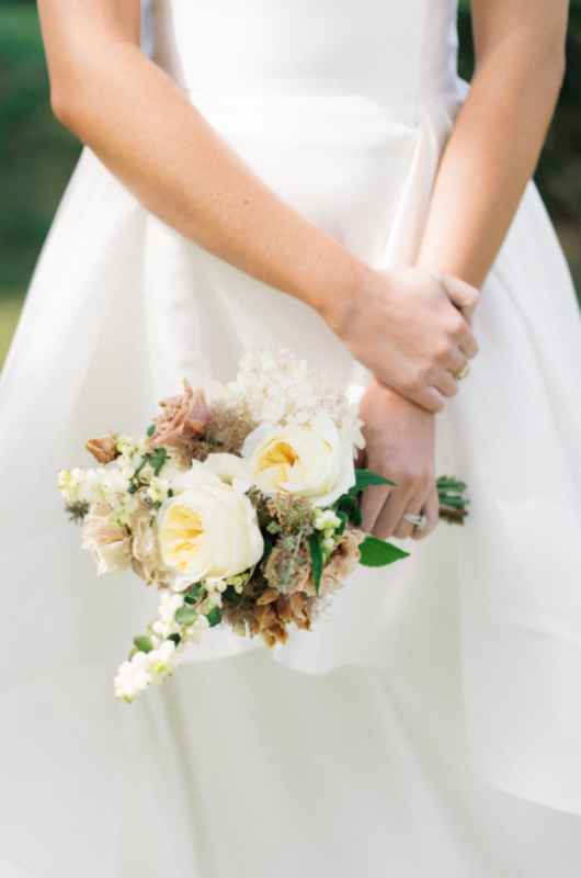 Ralph Lauren Inspired Autumnal Editorial Nestled In The Hills of Northern Kentucky bride holding flowers