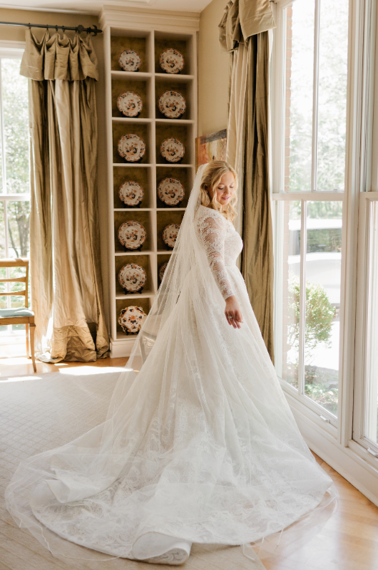 Mary Katherine Harris and James Rose Real Weddings bride full dress by window