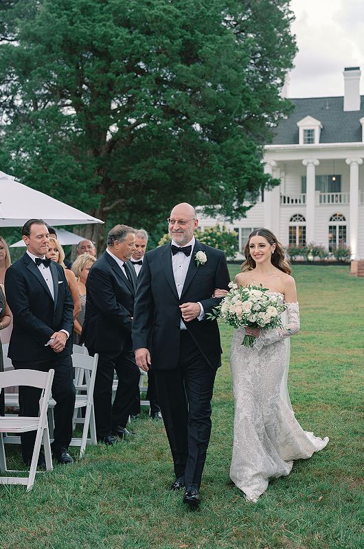 Marissa Newberger And Cole Nowlin walking down the aisle