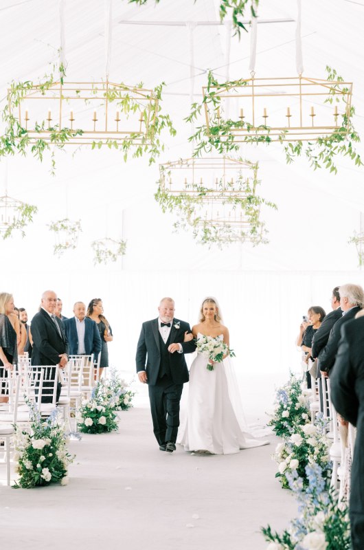 McKenna Holden And Tres Santucci walking down the aisle