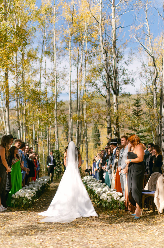 caelynn and dean real wedding bride walking down the aisle behind