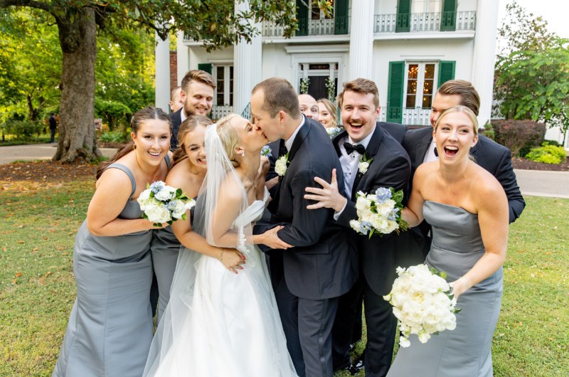 Courtney Young And John Couvillion bridal party laughing