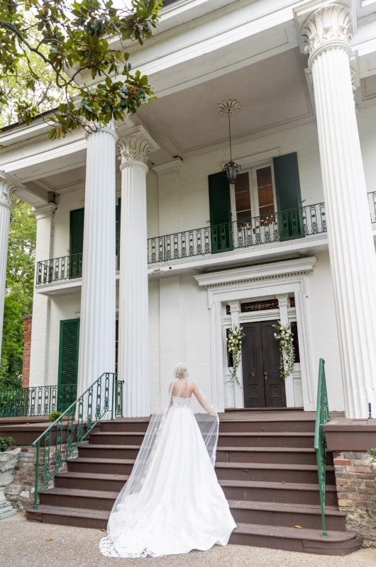 Courtney Young And John Couvillion bride on stairs