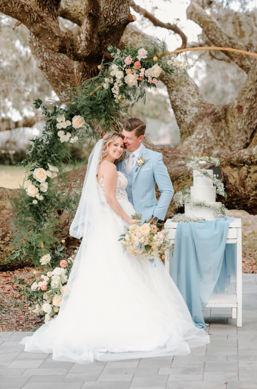 Southern Serenity Brooksville Florida couple with wedding cake