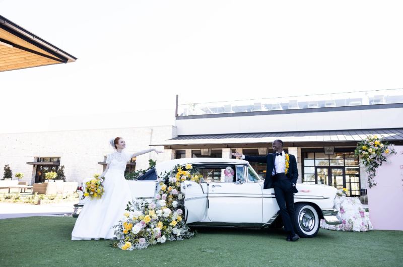 austin styled shoot country hill couple on opposite car ends