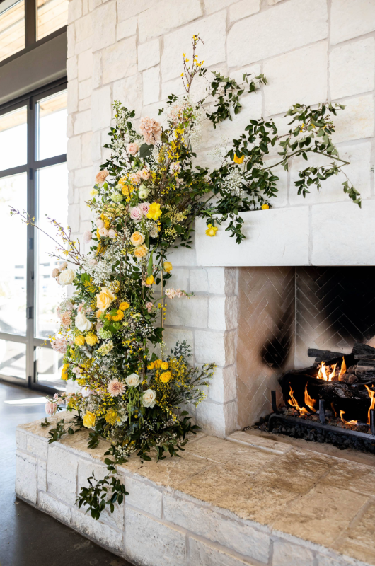 austin styled shoot country hill fireplace flowers
