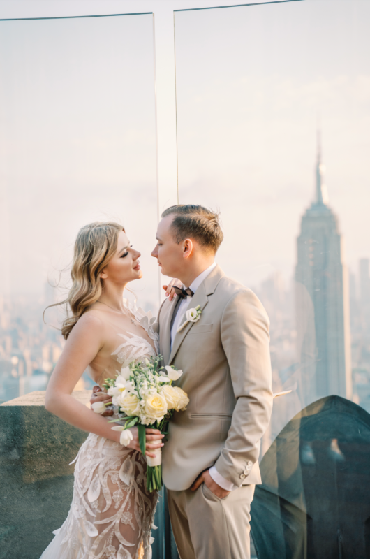 new york styled shoot central park couple with tower behind them