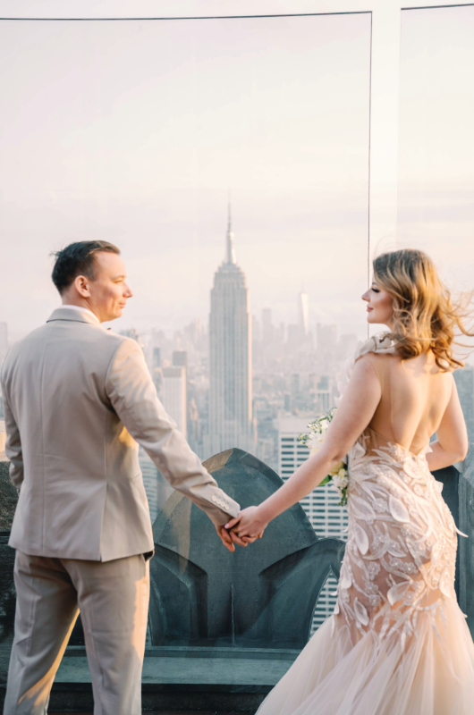 new york styled shoot central park tower between couple