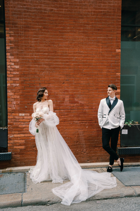 new york styled shoot couple against the wall