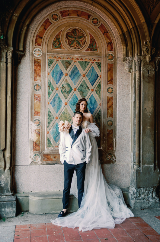 new york styled shoot couple standing before painting