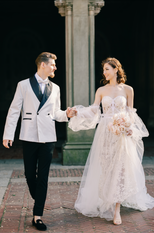 new york styled shoot holdng hands to smile