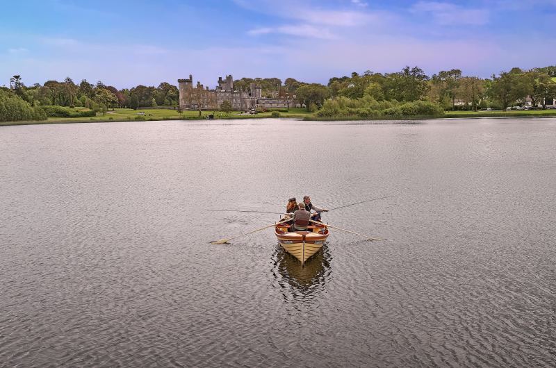 Fairytale Weddings Say I Do to Old World Charm at the Dromoland Castle Co Clare Ireland rowing on a lake