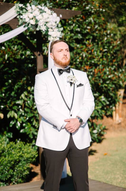 Chesney Wooten and Joshua Waldrop groom at altar